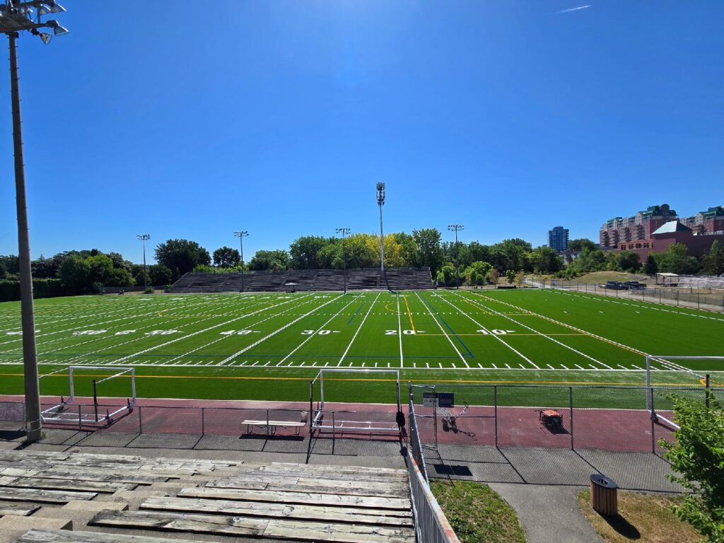 blue-synthetic-turf-football-field-aerial-view